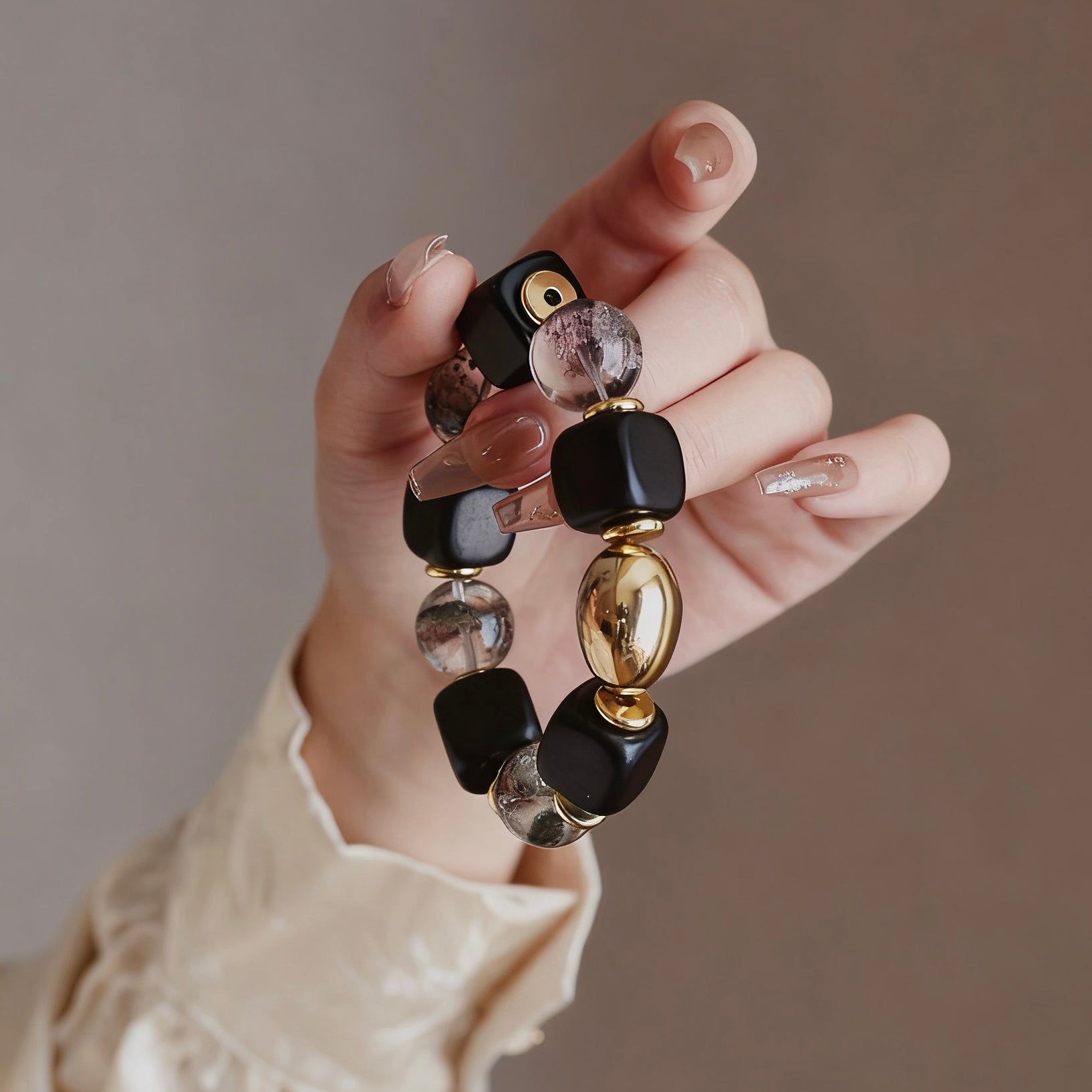 Minimalist display of the ebony and phantom crystal bracelet, highlighting its elegant and tarnish-resistant finish.