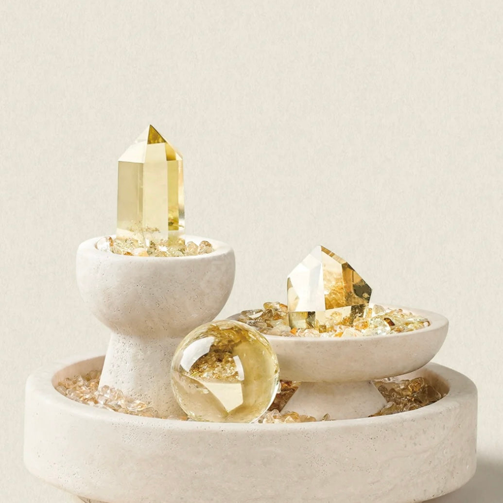 Macro shot of natural citrine points and sphere reflecting light with high-end elegance.