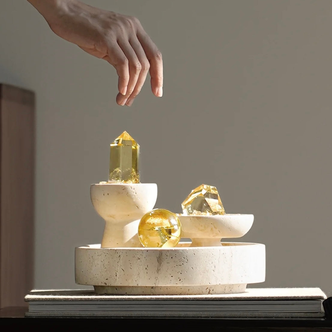 Hand holding a natural citrine point showing its transparent quality and directional energy.