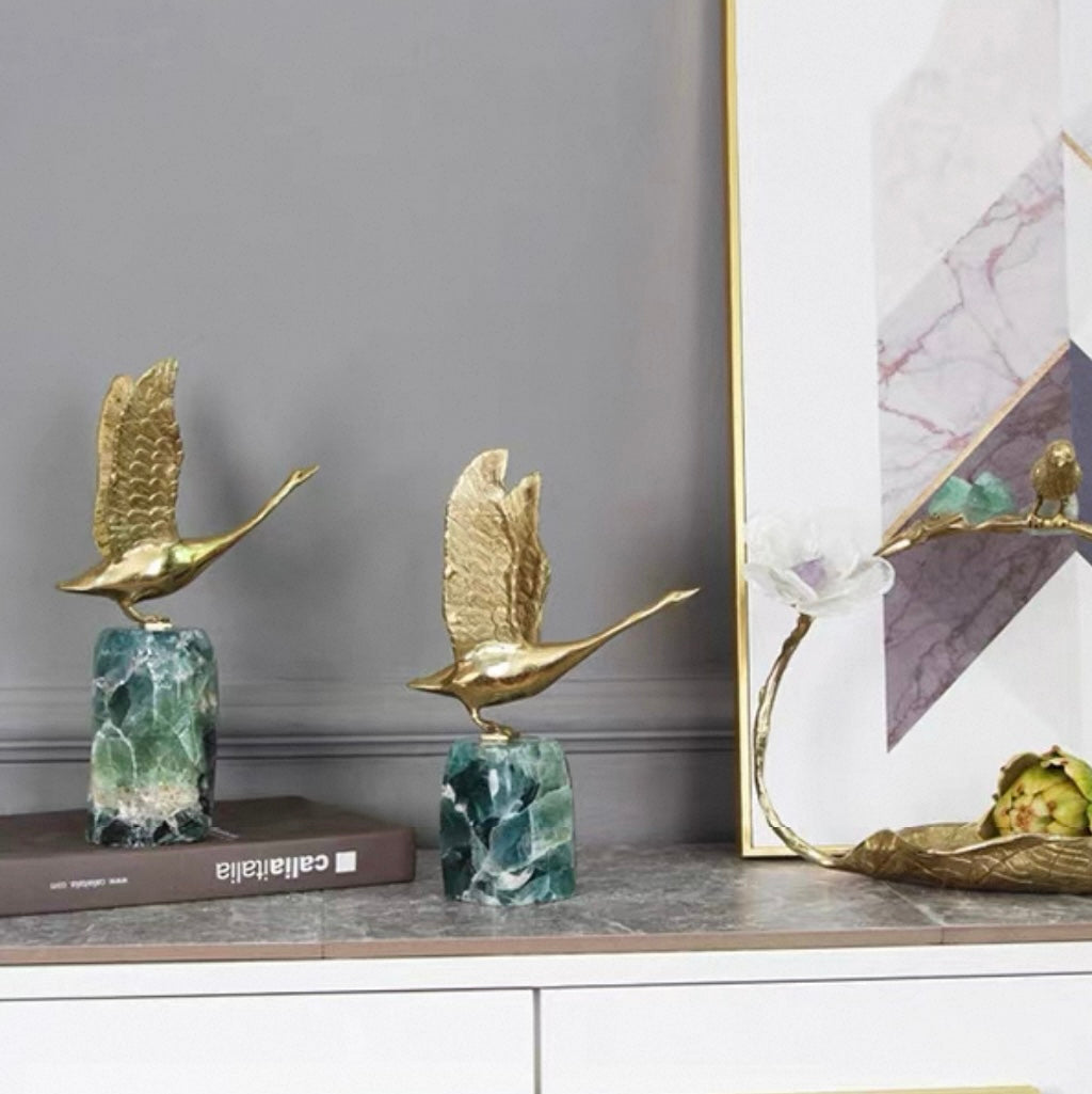 The Graceful Ascent Swan displayed in a modern home office, an elegant decor piece to elevate interior style and taste.