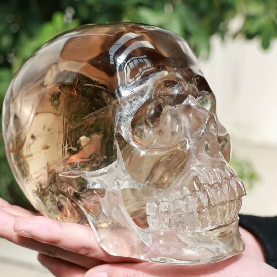 Close-up of Smoky Quartz skull carving highlighting lifelike bone ridge texture and deep smoky crystal depth