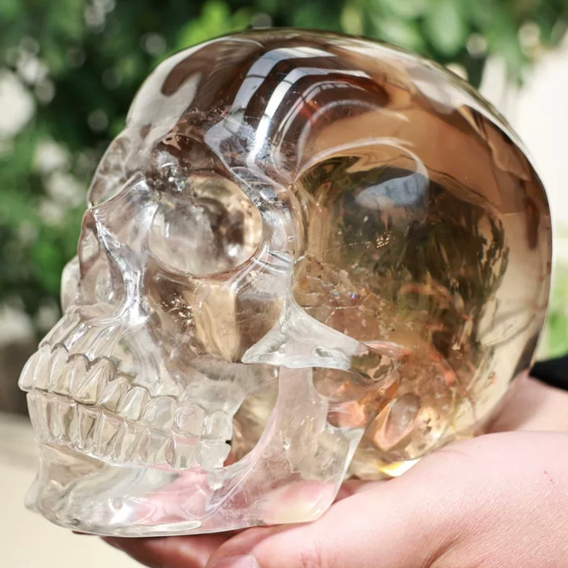 Top-down view of Natural Smoky Quartz Skull Carving showing crown detail and natural crystal inclusions