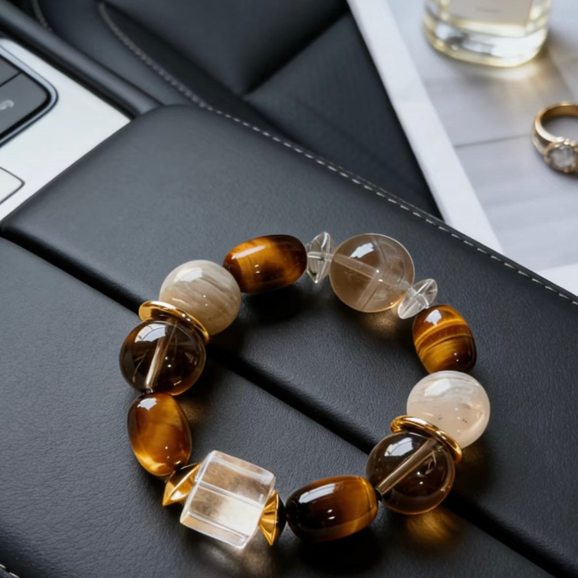 Natural sunlight reflecting through high-clarity Clear Quartz and Smoky Quartz beads, highlighting the elegant crystalline purity.