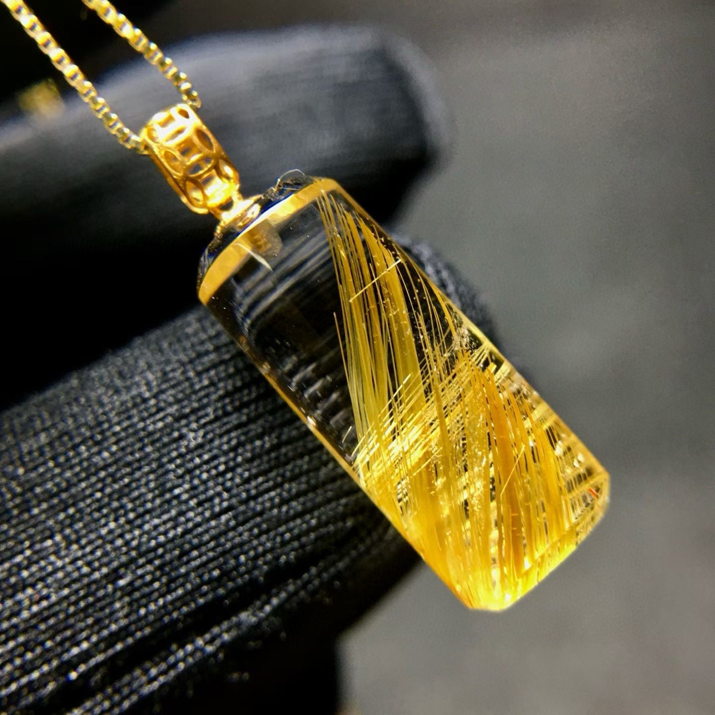 All-angle view of the unique golden stream rutilated quartz pillar, showing its specific internal patterns.
