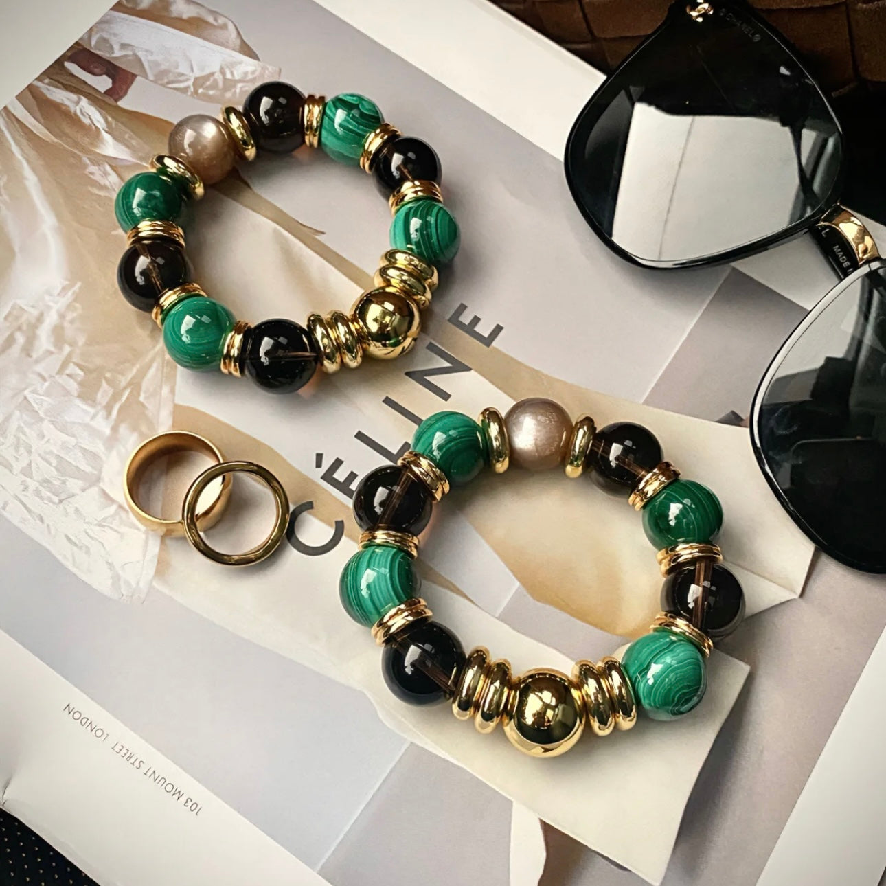 Styling the malachite and smoky quartz statement bracelet with high-end corporate attire.