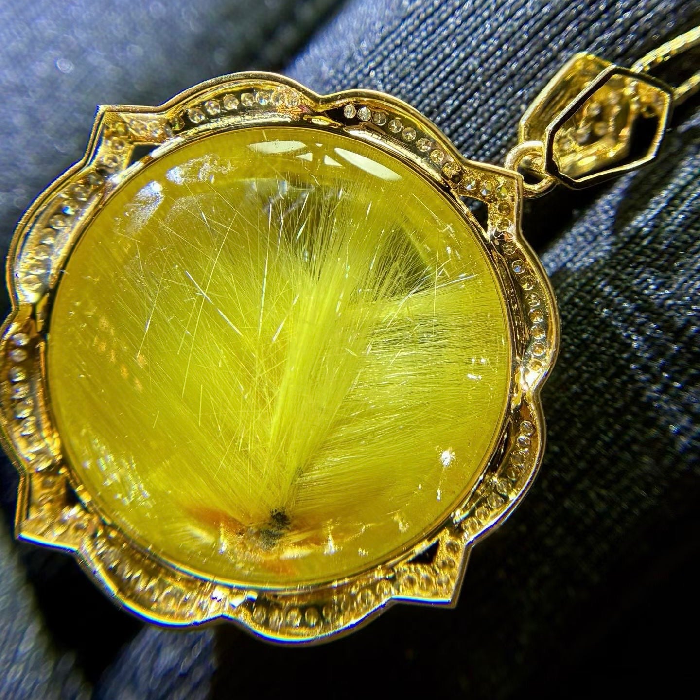 Macro shot of the rare star-center rutile formation, highlighting its perfect natural symmetry.