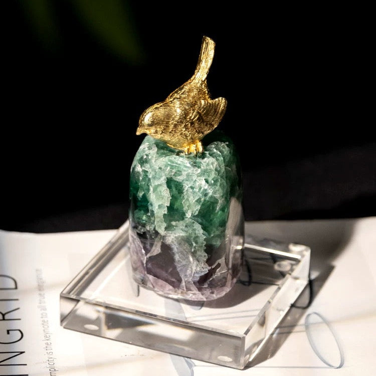 Macro shot of the natural green and purple fluorite stone, showing its vibrant luster and healing energy.