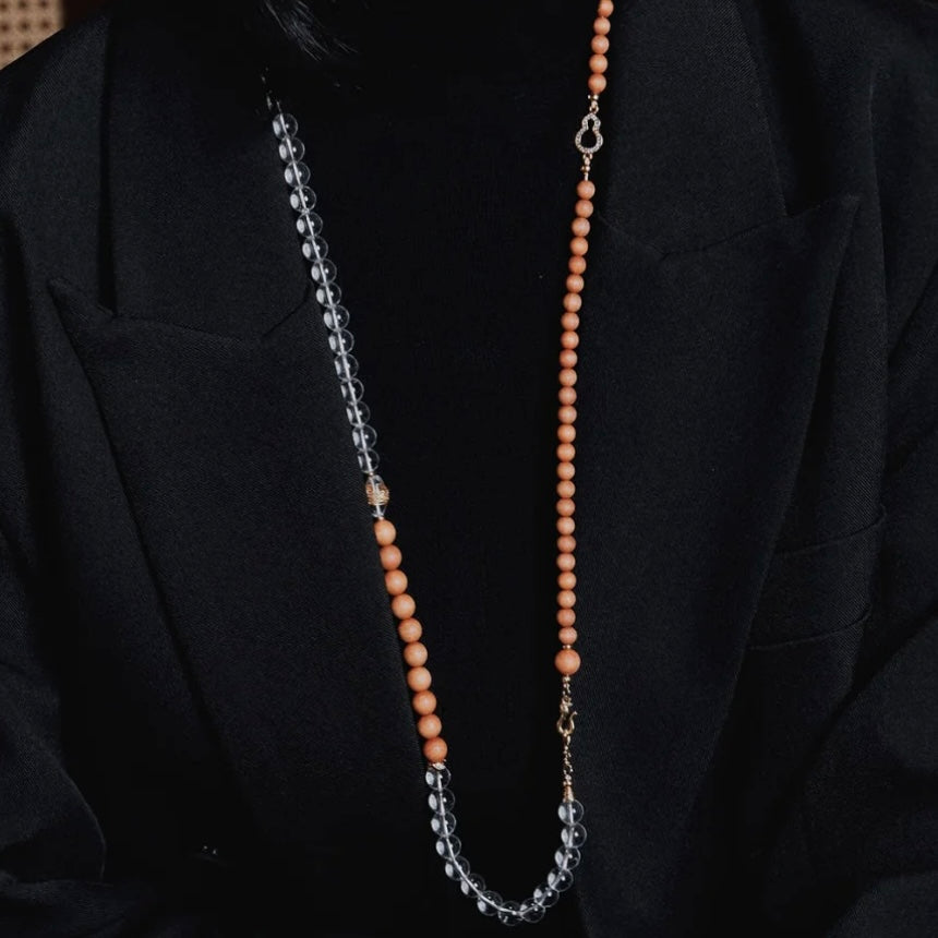 Showing the Clear Quartz and Sandalwood beads wrapped around the wrist, conveying a sense of serene, personal protection.