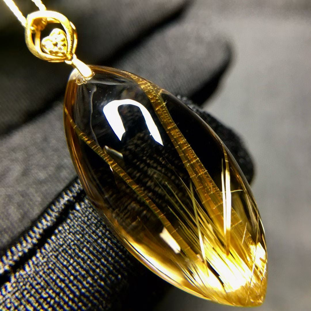 Macro view of the unique solar flare internal rutiles, highlighting the stone's rare natural fingerprint.