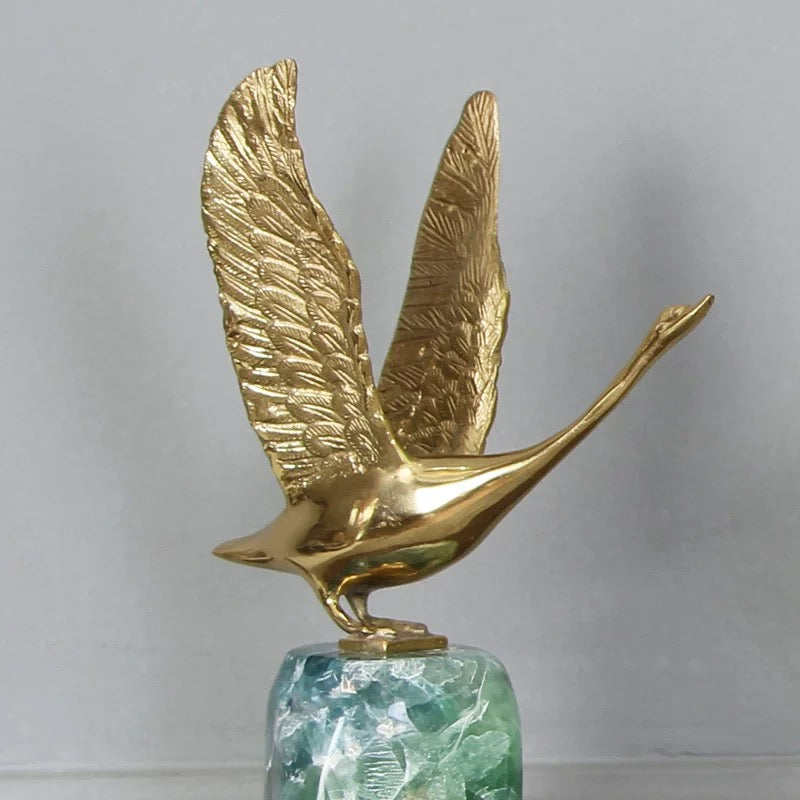 Close-up of the intricate feather textures on the solid brass swan wings, showcasing exquisite artistic craftsmanship.