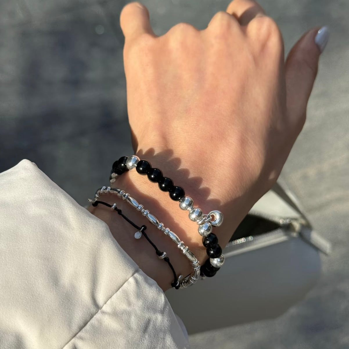 Delicate S925 sterling silver rice bead bracelet layered with crystal and beaded bracelets — stackable fine jewellery wrist styling for minimalist everyday looks