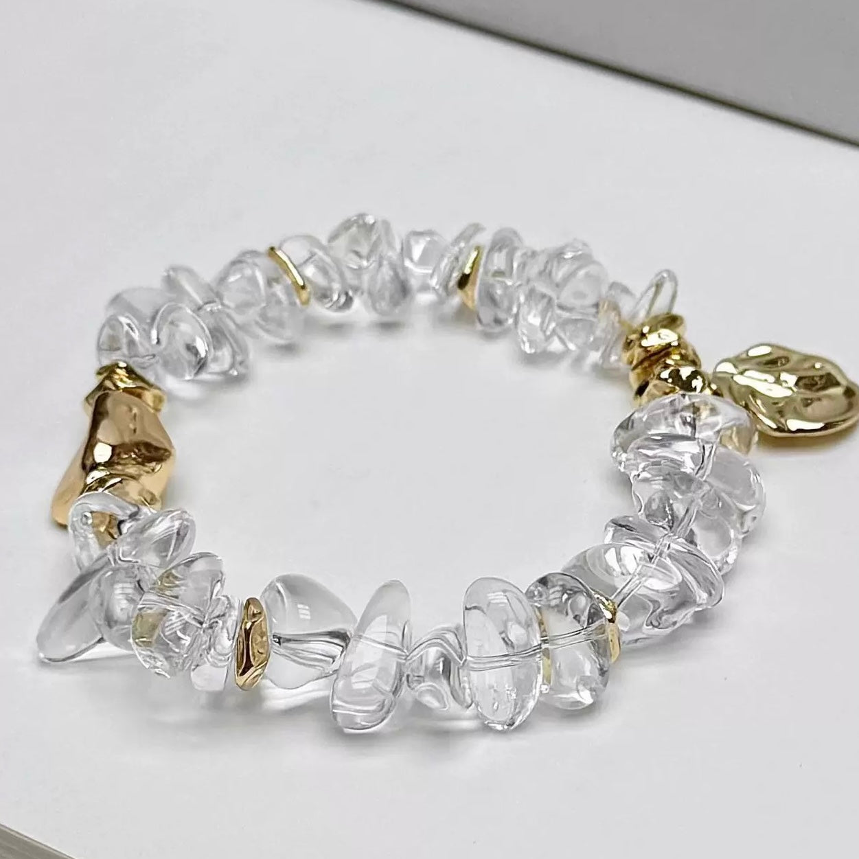 Close-up of the tarnish-resistant 24K gold-plated hardware and unique organic crystal beads.