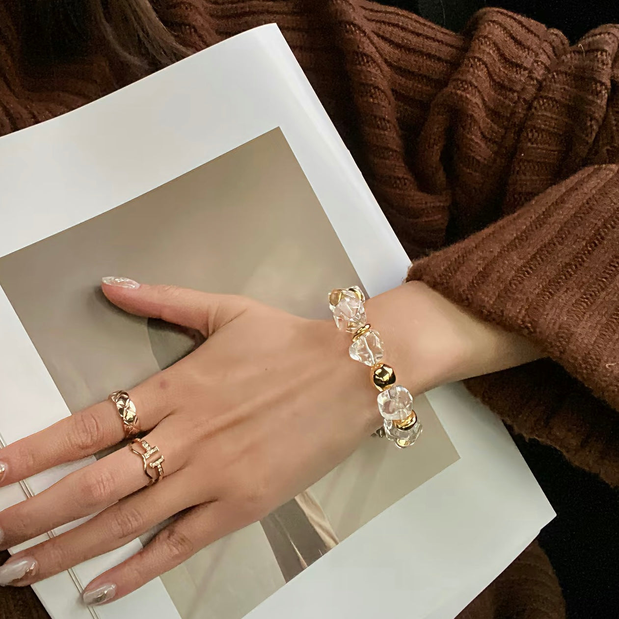 Close-up of the tarnish-resistant 24K gold-plated titanium steel accessories and chunky chain.