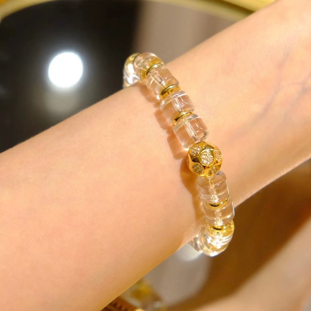 Macro shot of the color-preserving gold-tone accessories and geometric bead links.
