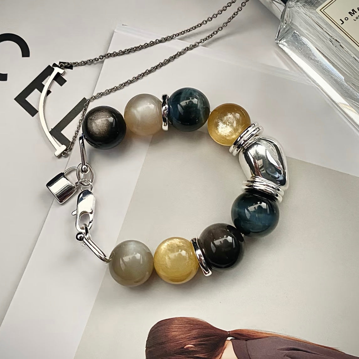 Close-up of Blue Tiger's Eye, Moonstone and Silver Obsidian beads on natural gemstone bracelet