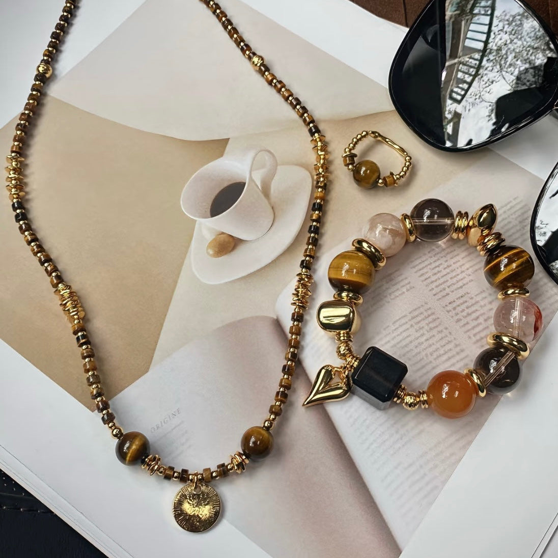 Vintage brown crystal 3-piece set styled flatlay - Tiger's Eye rutilated quartz ice obsidian 24K gold Gentle Crystals