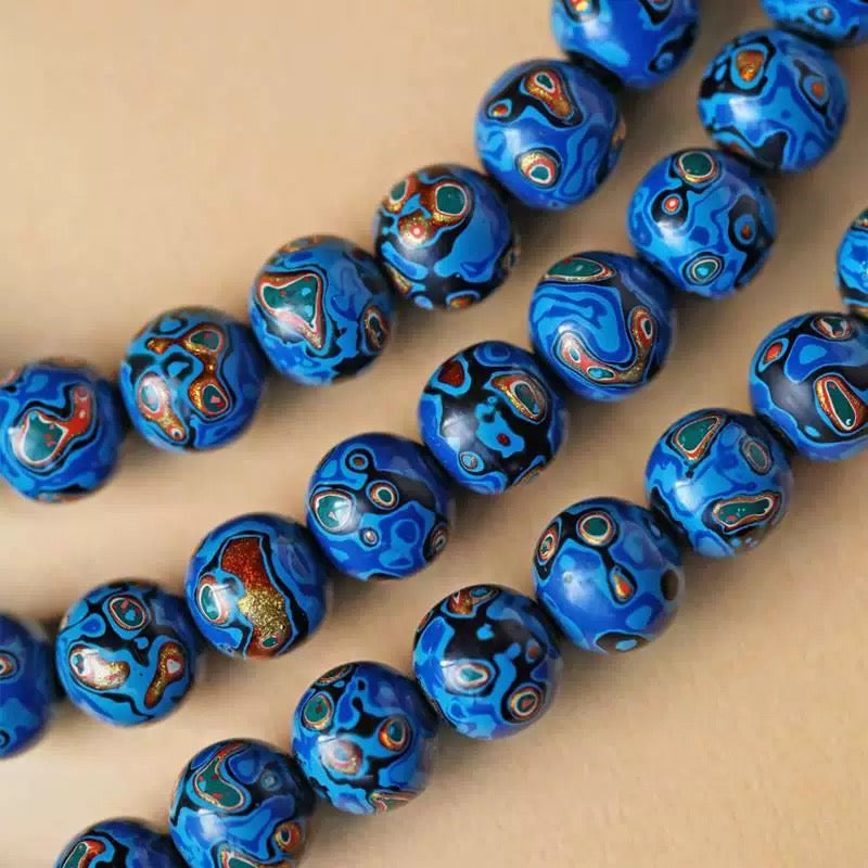 Close-up details of handmade blue lacquer spiritual beads