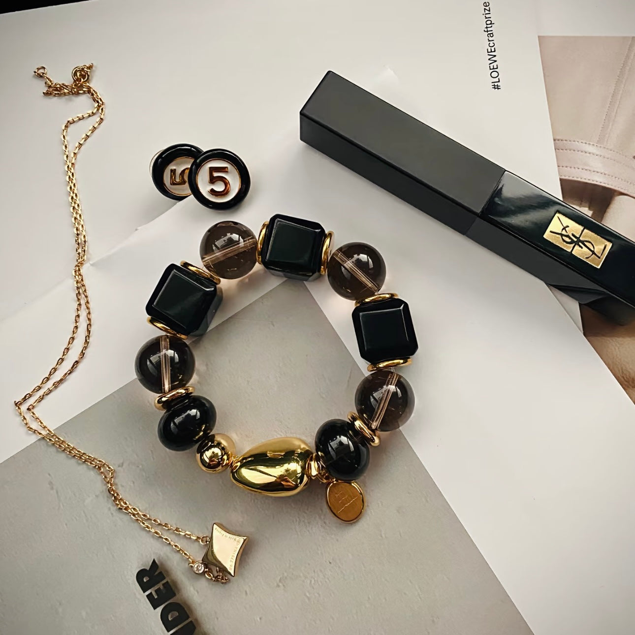 Twilight Narrative black obsidian smoky quartz bracelet styled flatlay - 14mm grounding crystal bracelet 2026 Gentle Crystals