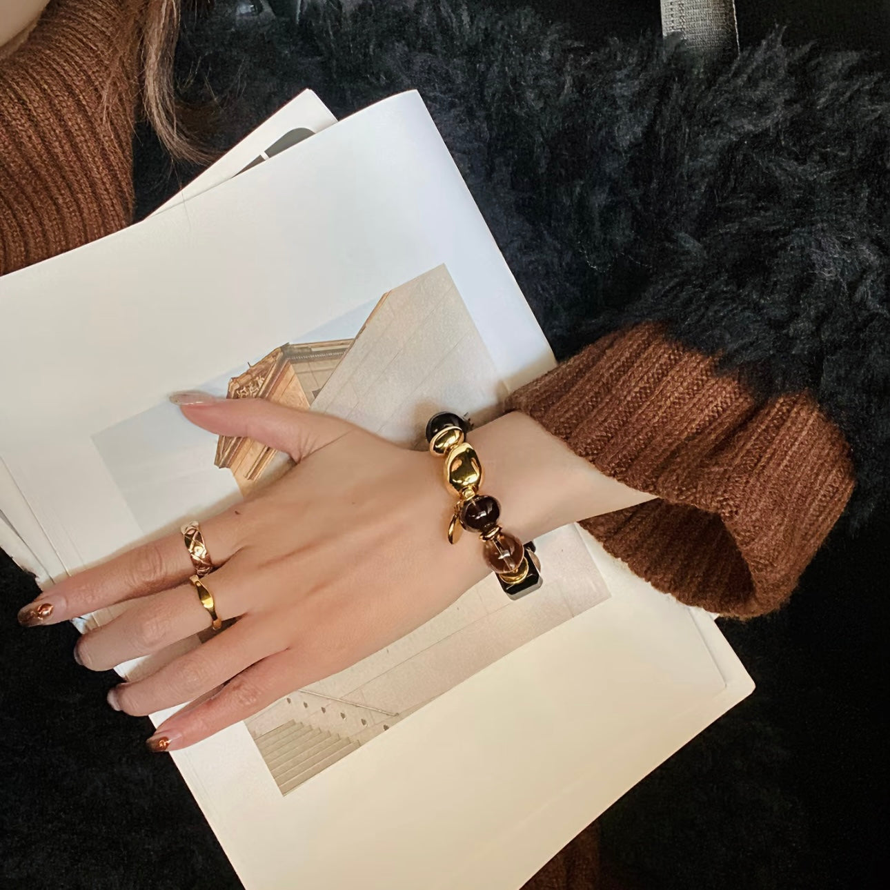 Editorial model wearing Twilight Narrative obsidian smoky quartz bracelet - grounding crystal jewelry 2026 Gentle Crystals