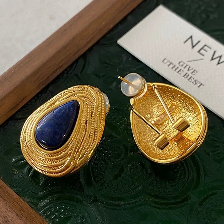 Side view of the 18k gold plated 925 silver setting, highlighting the detailed spiral texture.