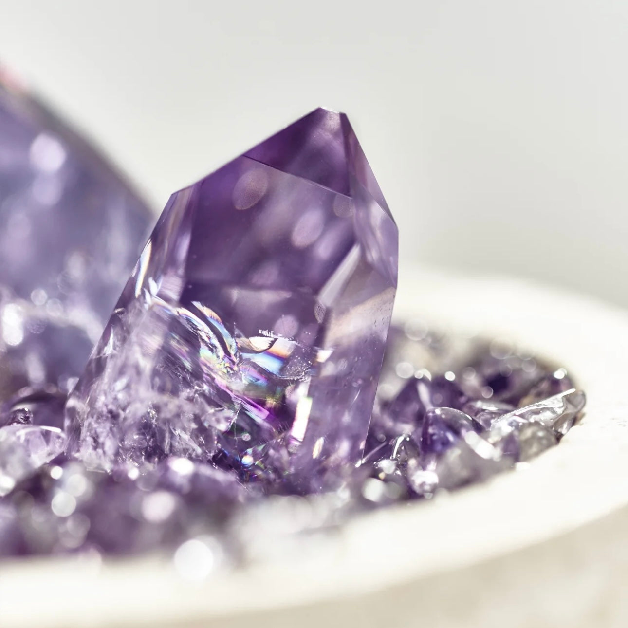 Elegant amethyst ornament displayed in a home study, measuring 9cm by 10cm for perfect energy placement.